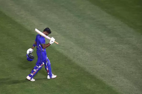 Monank Patel celebrates after a powerful shot
