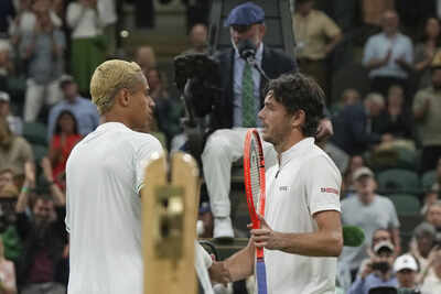 Fritz greets Diallo after Wimbledon match